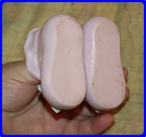 PAIR OF PINK BABY BOOTIES WITH RAISED FLORAL DETAIL