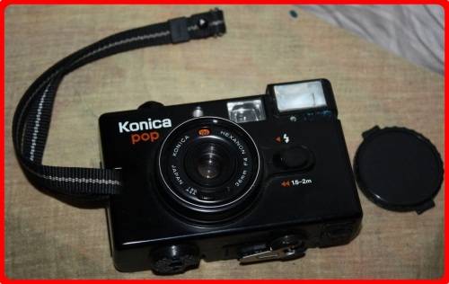 VINTAGE KONICA POP CAMERA WITH CASE AND LENSE COVER  SOLD AS IS