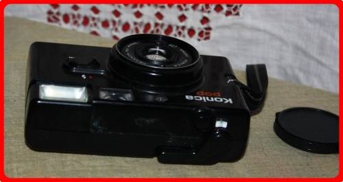VINTAGE KONICA POP CAMERA WITH CASE AND LENSE COVER  SOLD AS IS
