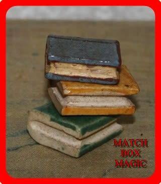LOVELY TRIO OF POTTERY BOOKS MINIATURE LENGTH OF YELLOW 3CM WIDTH  1 CM