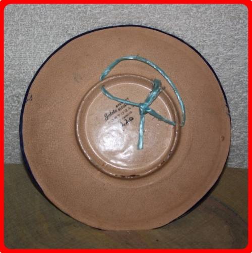 VINTAGE HAND PAINTED FLORAL WALL PLATE FROM PORTUGAL  STAMPED ON BACK