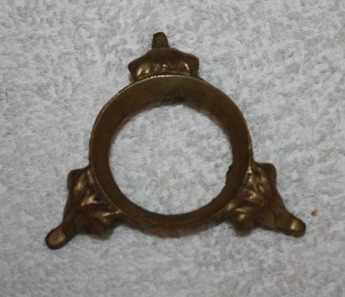 LARGE DECORATIVE CERAMIC EGG . WHITE BACKGROUND WITH BLUE RIBBON AND FLORAL DETAIL ON A LOOSE METAL