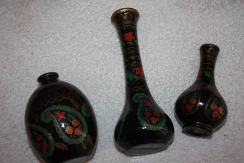TRIO OF BEAUTIFULLY HAND PAINTED VASES BLACK BACKGROUND WITH PAISLEY FLORAL AND GOLD TRIM FOREGROUND