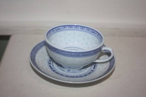 BLUE AND WHT CUP AND SAUCER ORIENTAL DESIGN WITH DRAGON MOTIEF