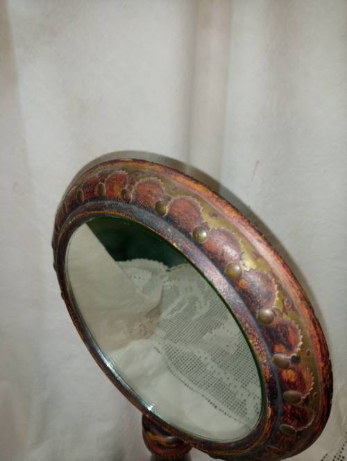 Upright wooden shaving mirror with metalwork decorative detail