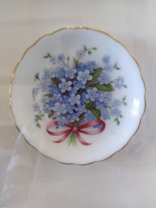 Beautifully framed trio of forget-me-not porcelain pin plates