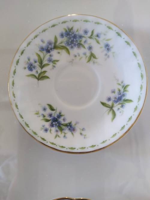 Beautifully framed trio of forget-me-not porcelain pin plates