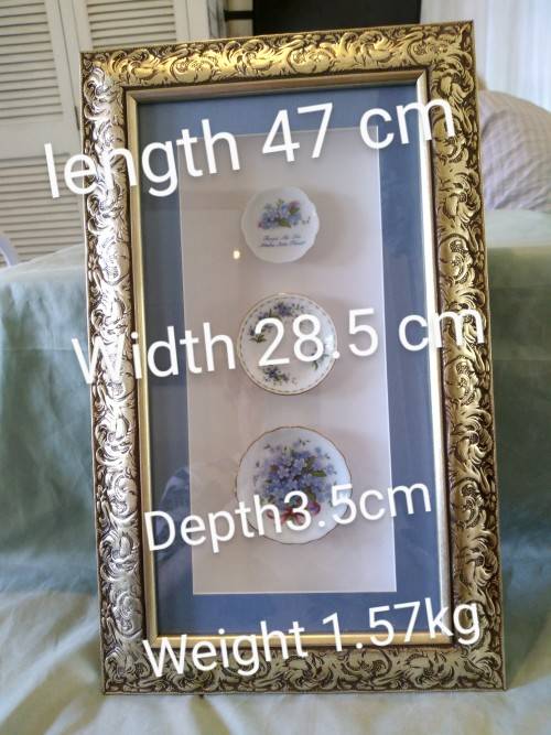 Beautifully framed trio of forget-me-not porcelain pin plates