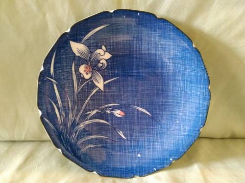 Genuine imperial  Imari plate. Blue background with stylized daffodils