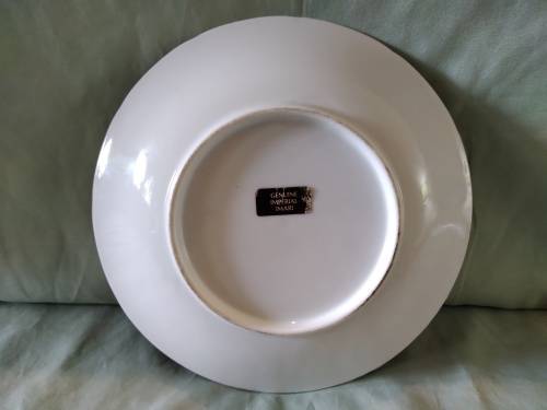 Genuine imperial  Imari plate. Blue background with stylized daffodils