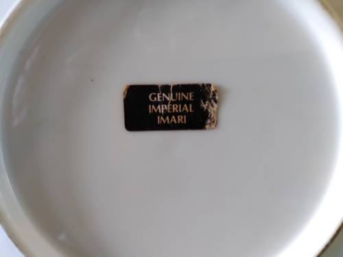 Genuine imperial  Imari plate. Blue background with stylized daffodils