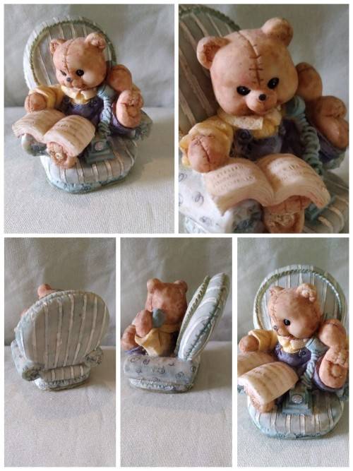Teddy bear in blue armchair talking on the telephone