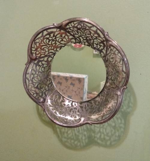 Repurposed vintage. Decorative mirror from epns frett work bowl.
