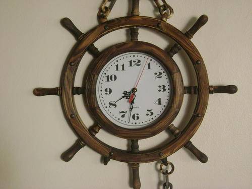 SHIP'S WHEEL-SHAPED WALL CLOCK - IN WORKING CONDITION