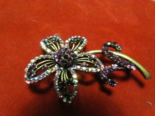 A ANTIQUE FLOWER BROOCH WITH PURPLE STONES MADE BY HANOVER!!