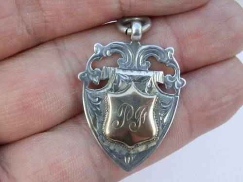 Antique silver and 9 ct gold pocket watch fob, Birmingham, circa 1925, 5.9 g.