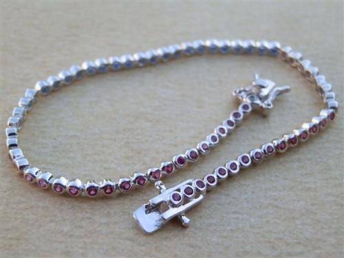 Charming solid sterling silver ruby and blue sapphire bracelet - weight 5.45 g.