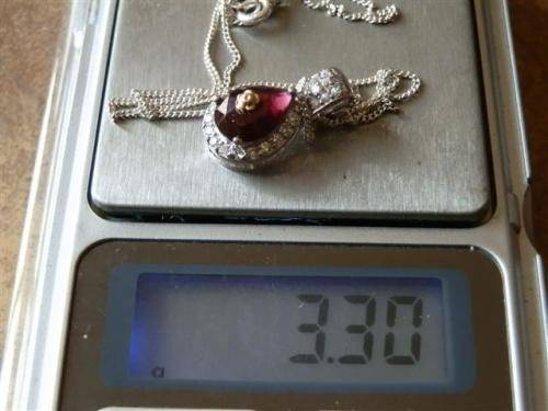 Astonishing solid 9 ct gold and sterling silver natural amethyst pendant and chain - weight 3.30 g.