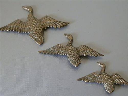 Vintage brass flying ducks
