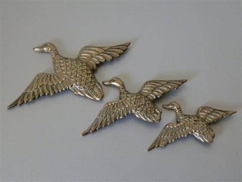 Vintage brass flying ducks