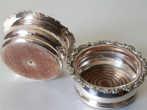 Pair of Victorian Silver Plate on Copper Coasters with Turned Wooden Basis.