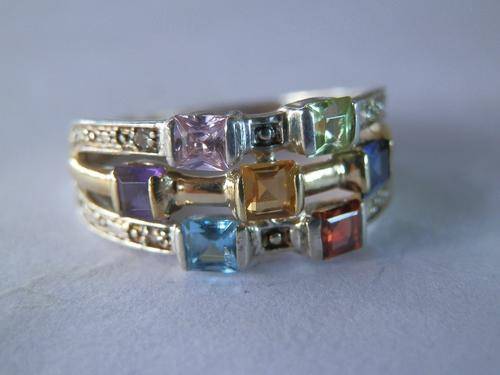 Silver and gold multi-gem ring with four small diamonds