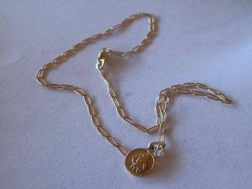 9ct Gold ankle chain and a charm - shipping R35 insured