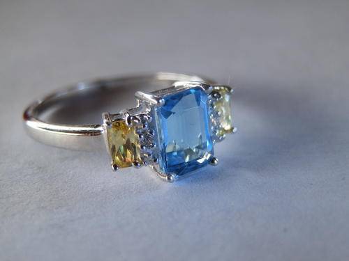 Sterling silver blue topaz and citrine ring - shipping R40 insured