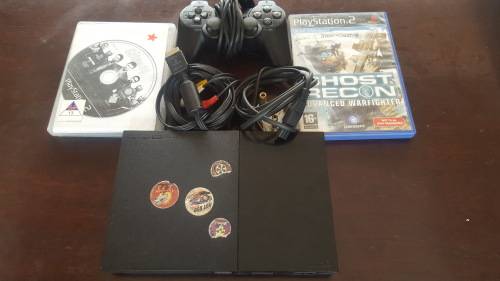 PS2 (Slim-Line) + 1 Controller + Cables + 2 Games