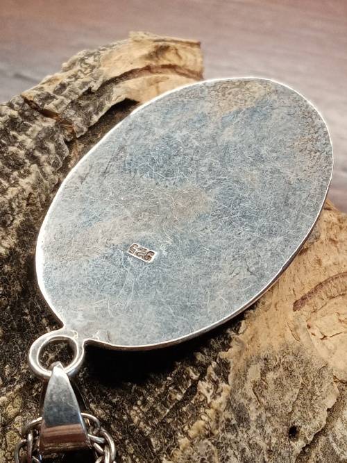 Sterling silver necklace with mother of pearl pendant size: 38mm by 26mm necklace length: 660mm