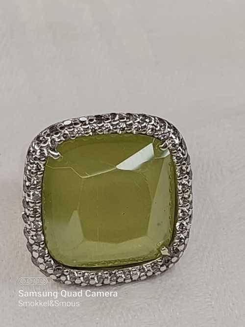 Sterling silver ladies ring with very large green stone surrounded with cubic zirconia Size: M.5