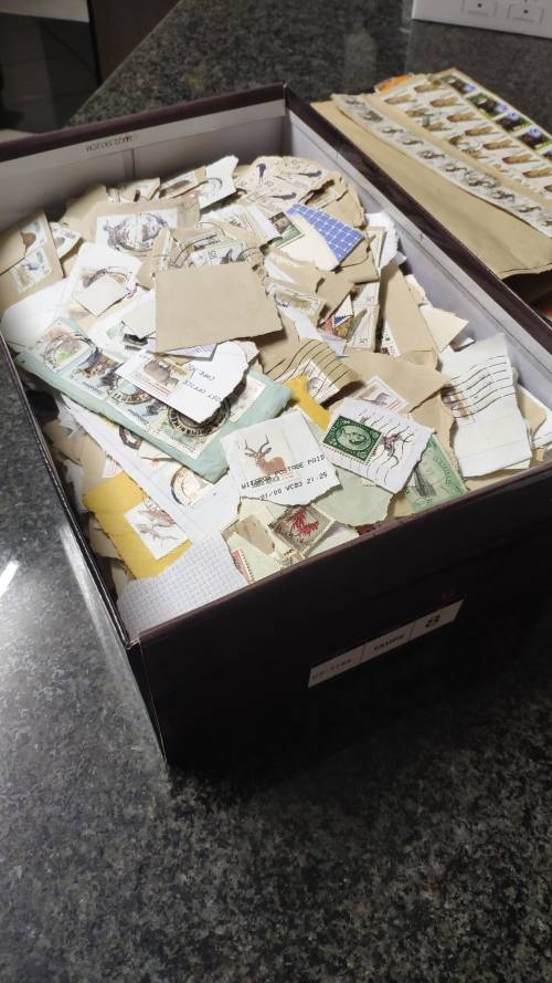 Shoe box with stamps. Many South African definatives and some from other southern african countries