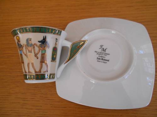 Highly decorated Egytian themed demi-tasse cup and saucer - Limoges