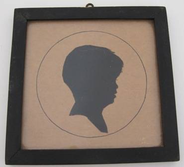 PROFILE CUT-OUT (Silhouette) OF A YOUNG PERSON, Framed behind glass