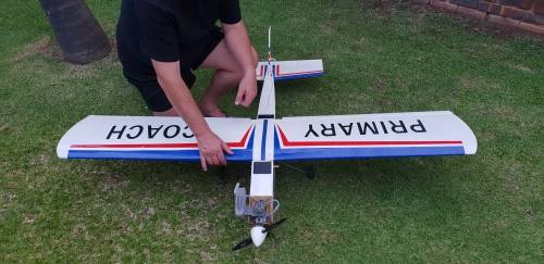 R/C Plane in 7/10 condition. Needs minor attention.  4 Servos, O.S. Max 75AX Two Stroke Glow Engine