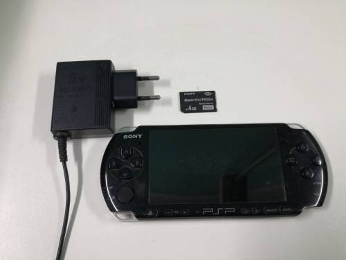 PSP + Charger + Memory Card + Games