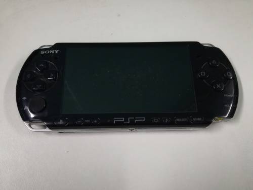 PSP + Charger + Memory Card + Games