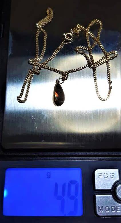 18ct yellow gold Curb Chain with 18ct Gold Pendent Set With A 14x7mm Teardrop Garnet. French made.