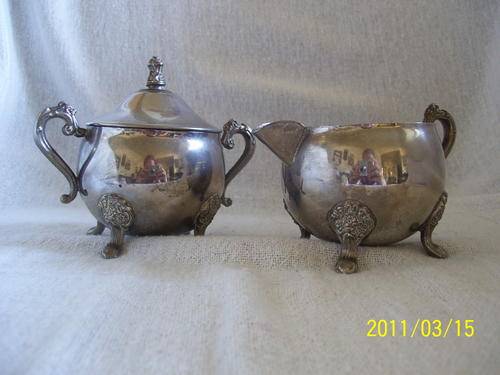 Very old silver plated milk jug and sugar bowl