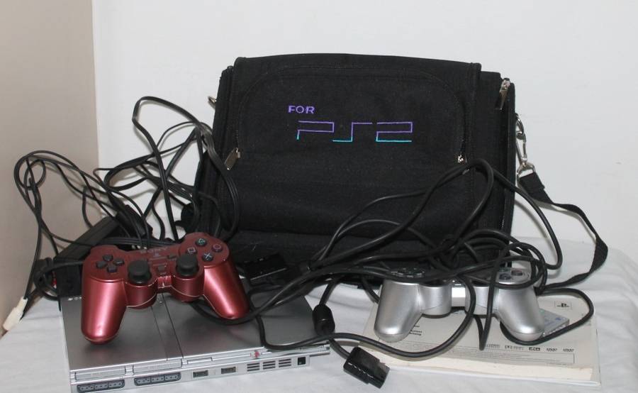 PlayStation 2  with 2 Controller`s, Memory Card, bag and manual