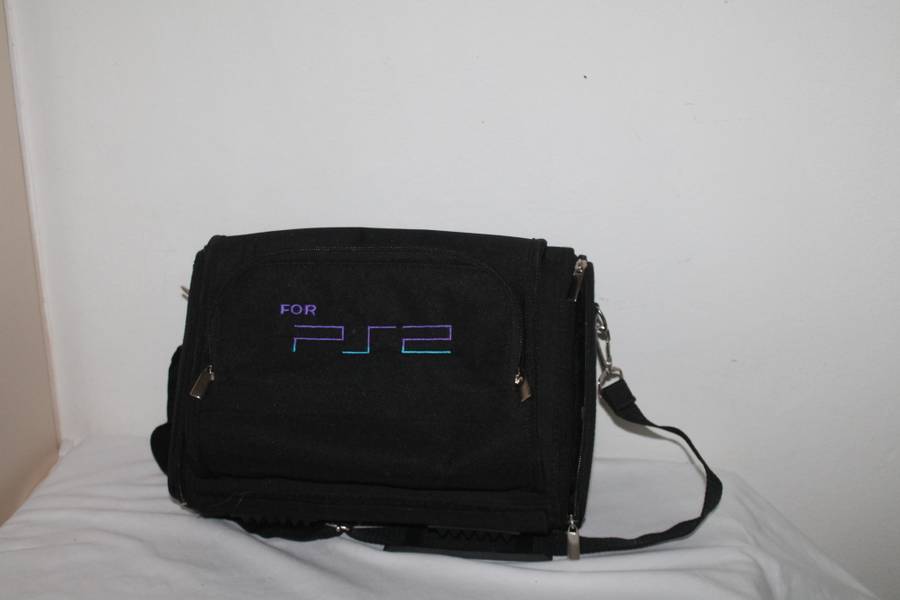 PlayStation 2  with 2 Controller`s, Memory Card, bag and manual