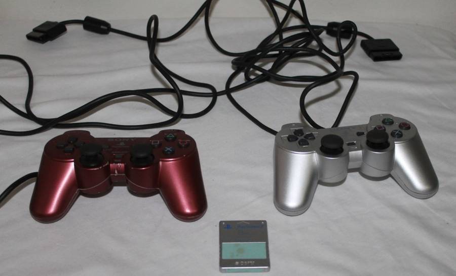 PlayStation 2  with 2 Controller`s, Memory Card, bag and manual