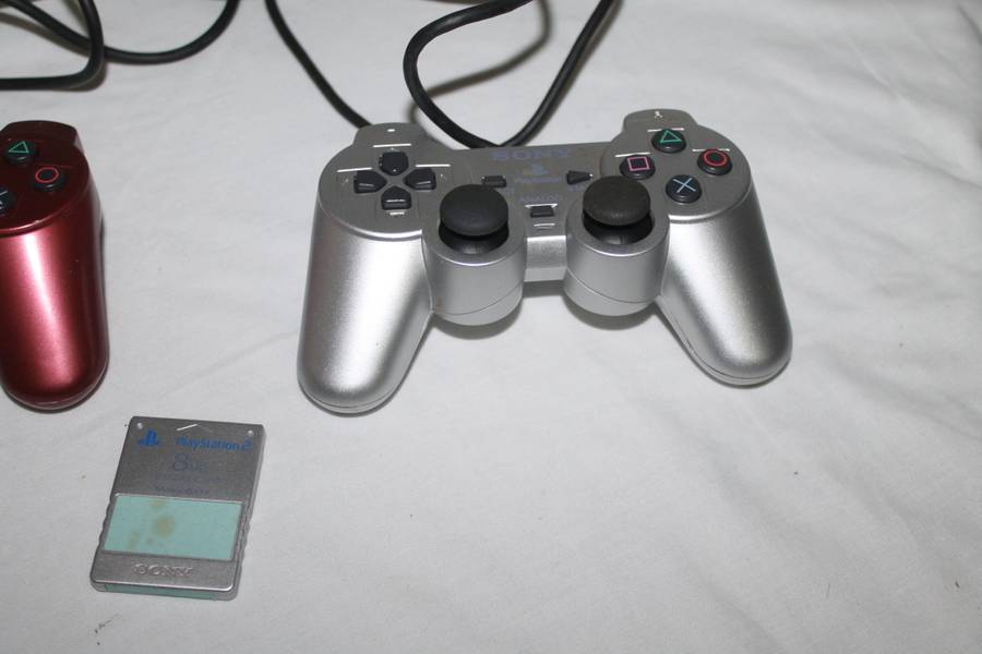 PlayStation 2  with 2 Controller`s, Memory Card, bag and manual