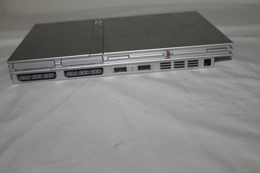 PlayStation 2  with 2 Controller`s, Memory Card, bag and manual