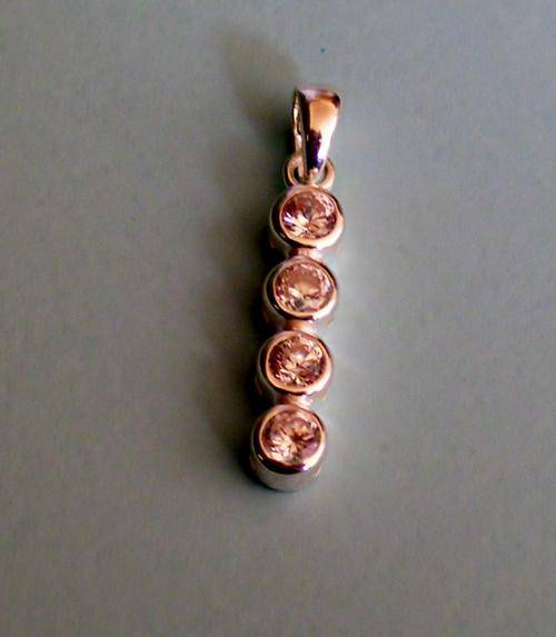 STUNNING Simulated Diamonds pendant set in Sterling Silver