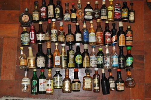 VINTAGE COLLECTION OF 58 SMALL (50ML) BOTTLES OF VARIOUS LIQUERS