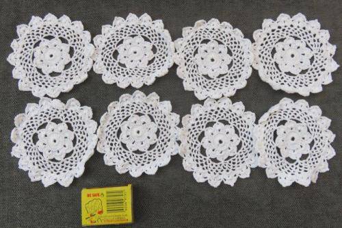 8 small white doilies