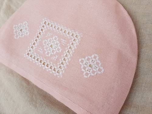 Pink tea cosy with hardanger needlework