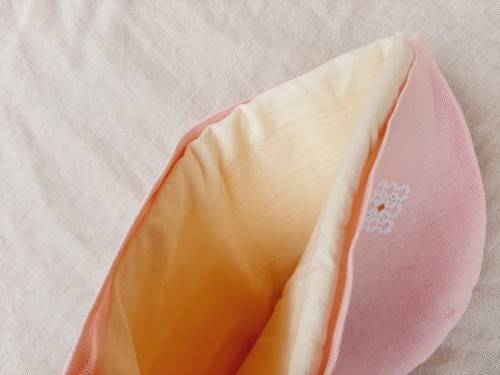 Pink tea cosy with hardanger needlework