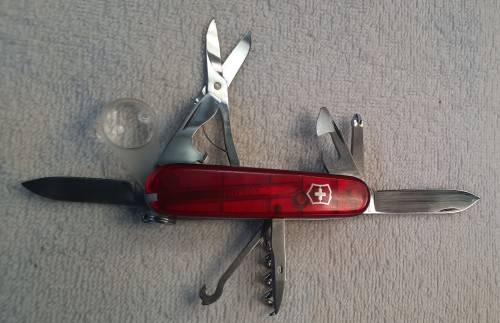 Victorinox -Explorer with red Translucent Scales tools as per pictures